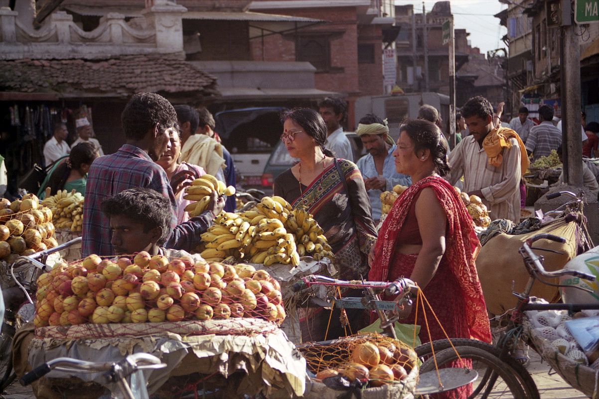 Kathmandu Durbar Square 04 03 Maru Tole Market Vendors sell fruit, vegetables, and flowers in Maru Tole at the southwestern corner of the Kathmandu Durbar Square.